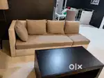 Grey and white fabric sofa with center table and a 4 seater dining set