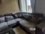 Sofa with cushions and centre table