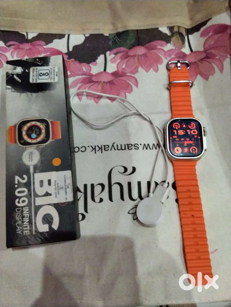Smart watch with orange strap only 2 months old