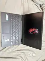 Laptop with its charger and also mouse