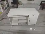 A white computer table and study table.
