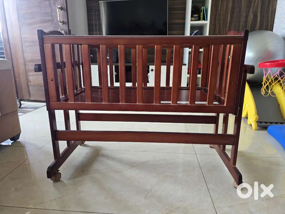 1 year old LuvLap wooden baby cot with mosquito net and mattress