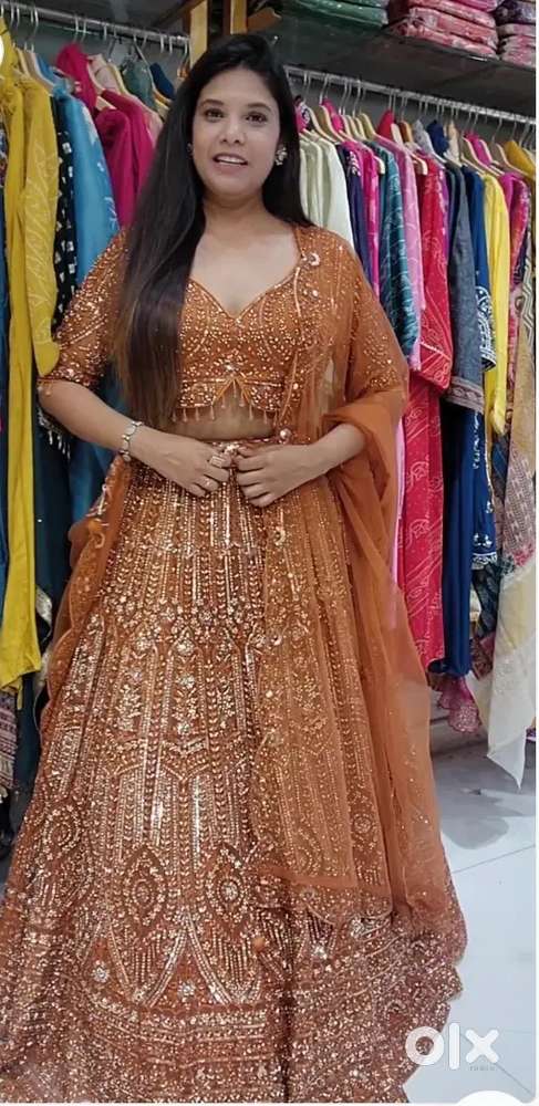 Rust orange aariwork stone embellished lehenga set
