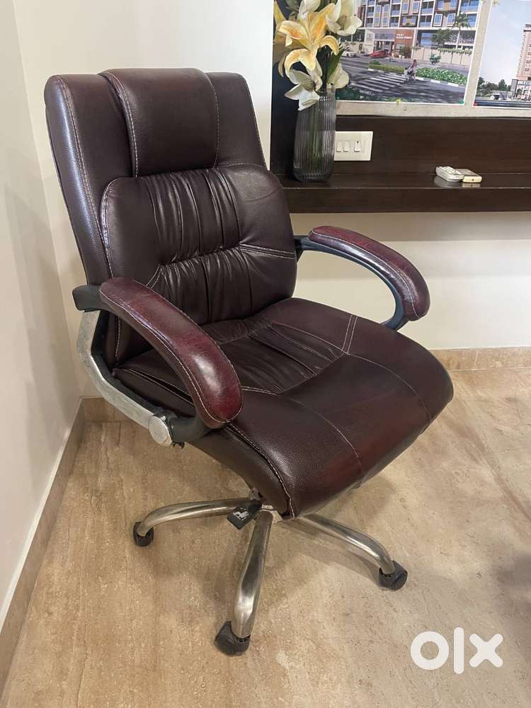 High-back leather executive office chair in a dark brown.