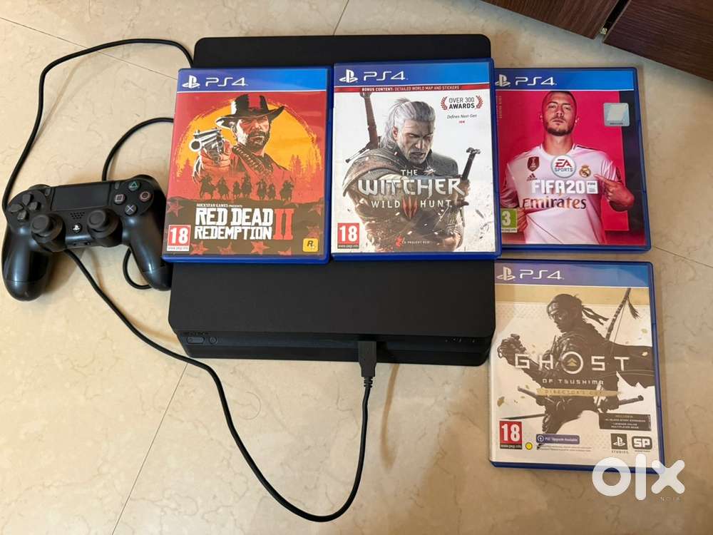 Play station 4 slim 1TB with games in excellent condition