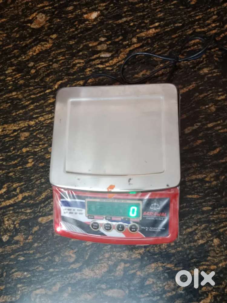 Electric weight machine and packing machine