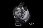 Omegaa XSwatch Earth Face watch