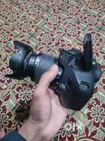 Canon EOS 1200D with two batteries and charger plus cover and bag.
