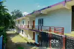 25 cent land with 8 family cottage and 2 shop @wayanad