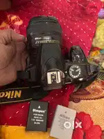 Nikon D3400 with 18-55mm kit lens and 50mm 1.8 (charger + 2 battery)