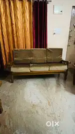 Teak wood sofa with Cushions.