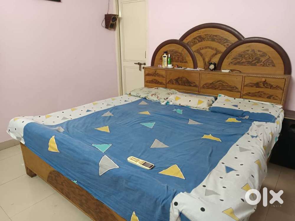 Wooden cot with storage