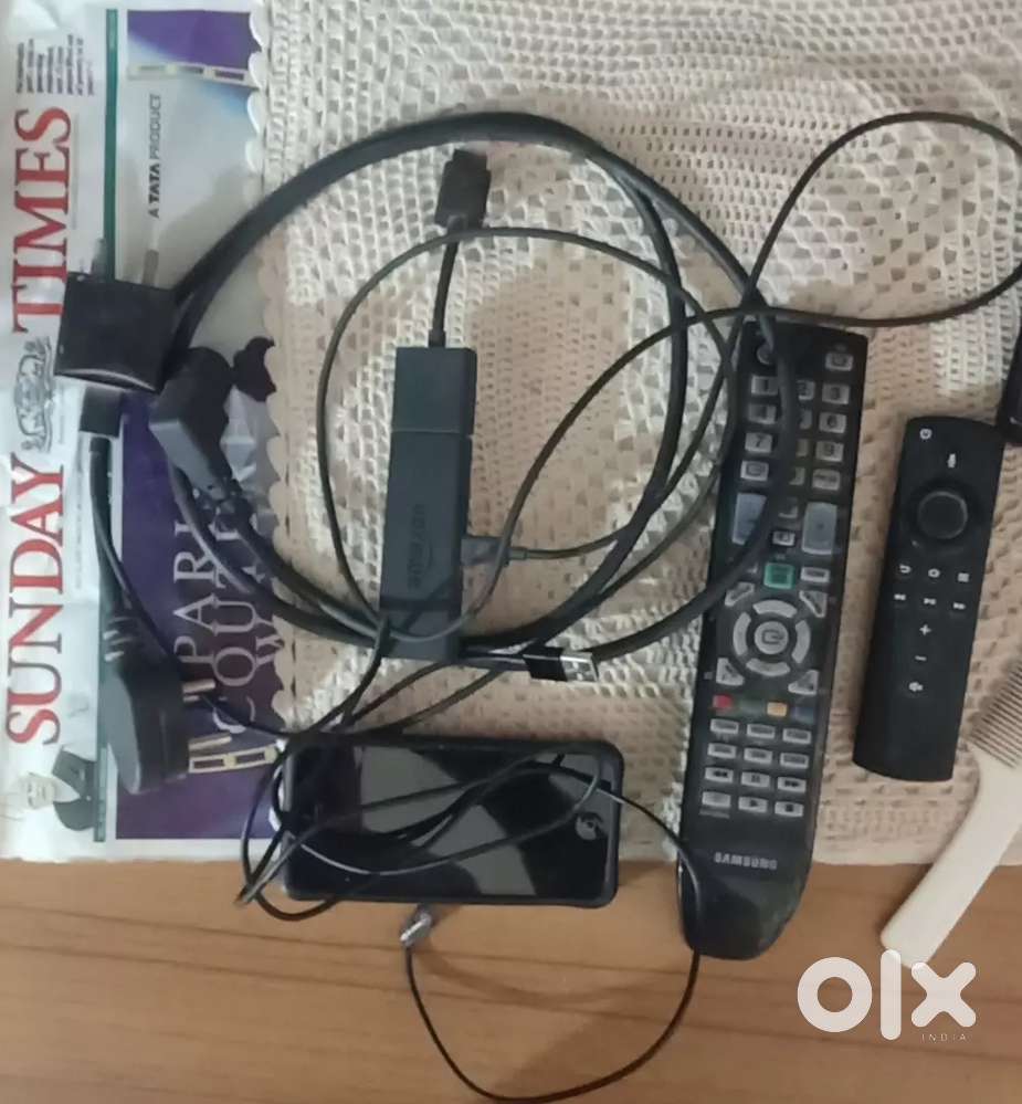 Amazon fire stick with remote, samsung tv remote and i phone