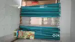 Utensils stand and curtains and gas stove
