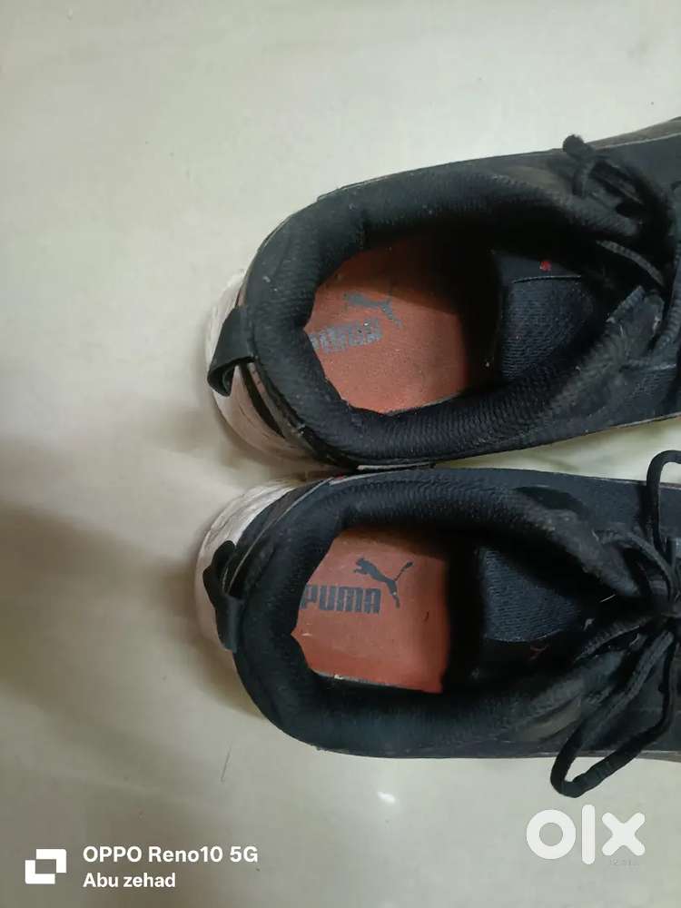black and red puma shoe