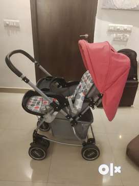 Pram which has rocker and tray for sale