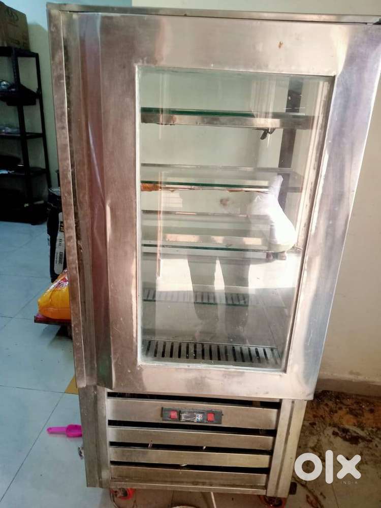 Vertical Pastry Display Unit and Paytm Pet Pooja POS Machine