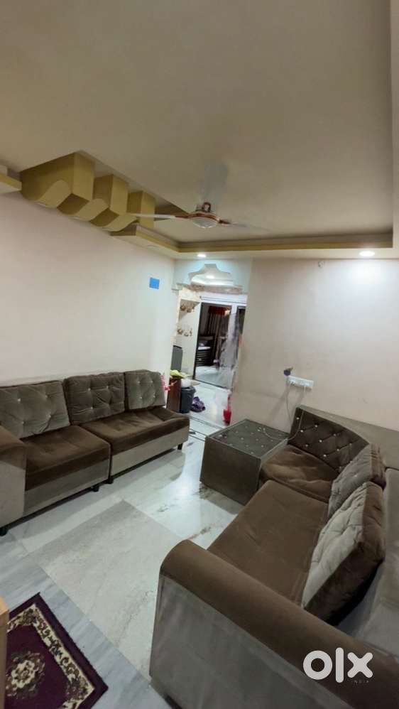 8 seater sofa with big cushions and a tea table