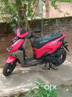 Hero zoom(ZX), Cubic capacity 110.90,  in Sport Red colour.