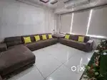7 seater sofa, 1 couch with 6 cushions and 1 glass corner table