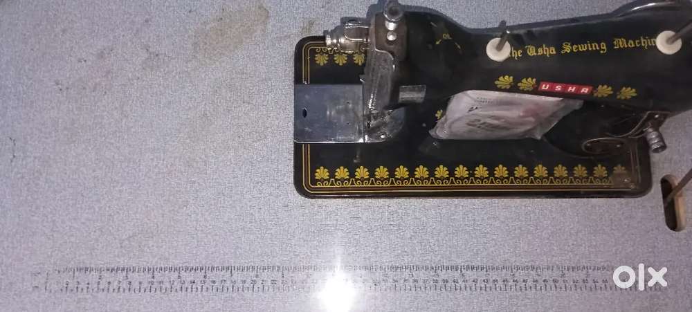 Usha sewing machine with table and foot pedal