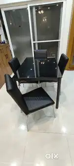 4 seater glass top dining table with chairs