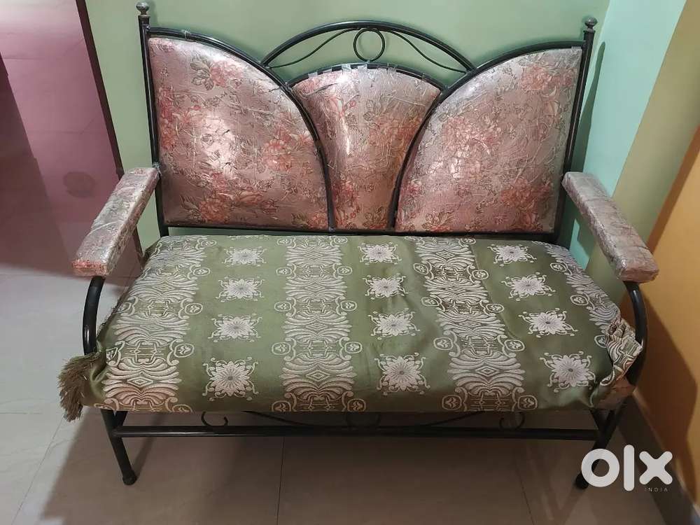 Iron frame sofa in moderate condition