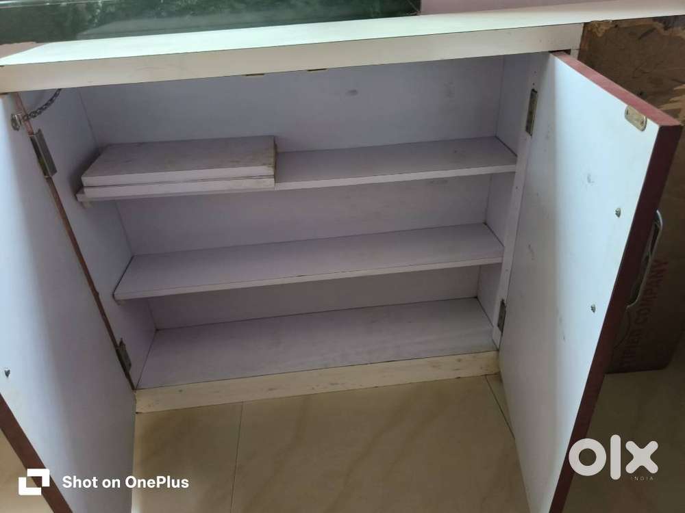 Cupboard with 4 racks in good condition.