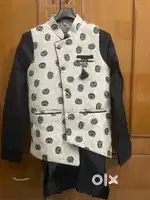 Kurta Pajama with Jacket and Punjabi jutti.