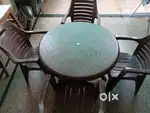 Round shape plastic table with four chairs