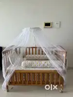 wooden baby crib with mosquito net