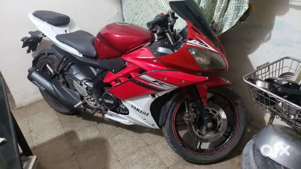 R15 in red white colour and FZS black green colour