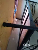 Double bed steel cot with plywood top