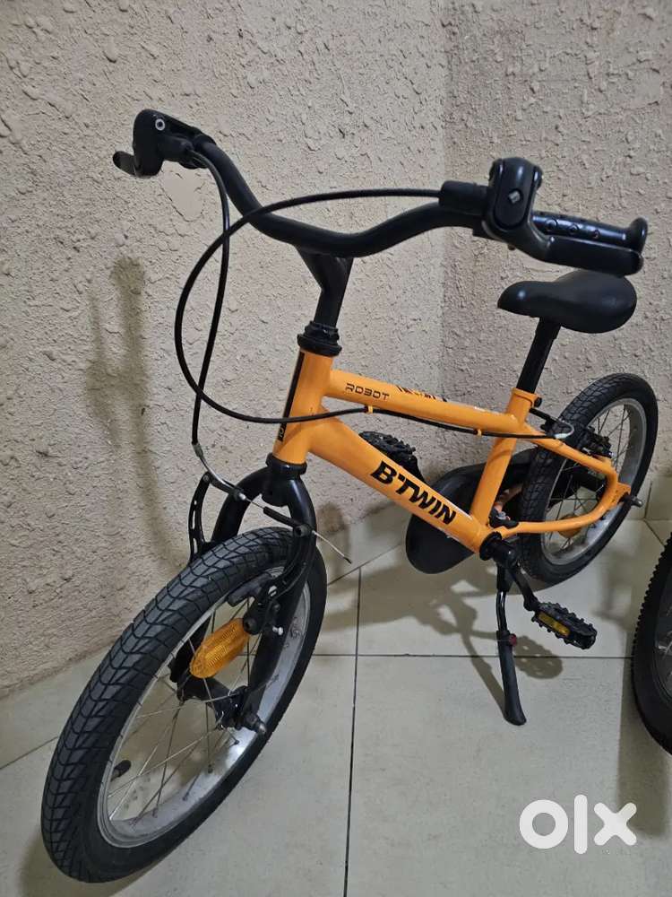 16T BTwin orange bicycle