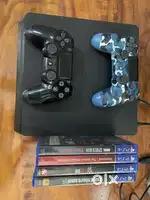 Ps4 Slim 1 tb With 2 Remote and 4 Games
