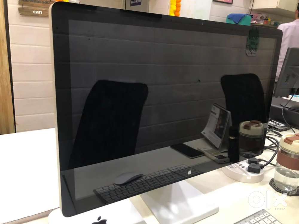 Modern office desk setup with iMac and accessories