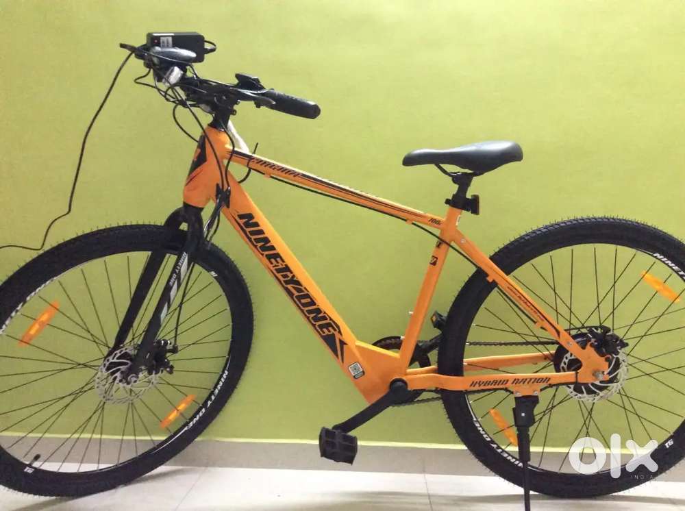 NINETY ONE Enigma 700C Single Speed Orange Electric Cycle