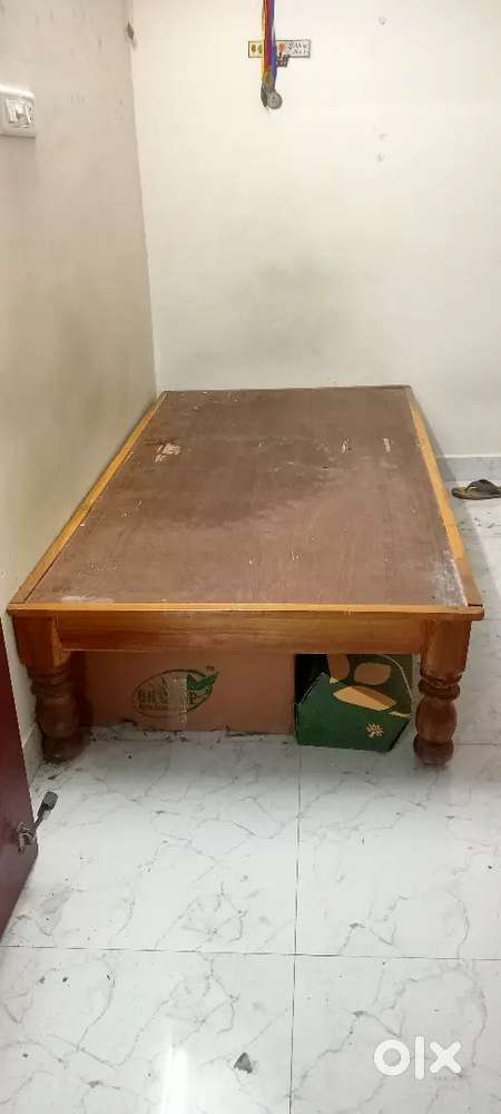 Wooden single bed without mattress