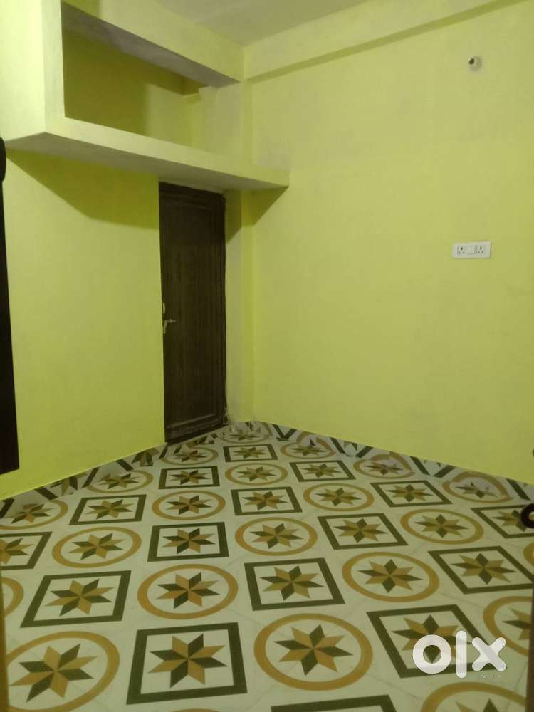 Room with bathroom and kitchen.