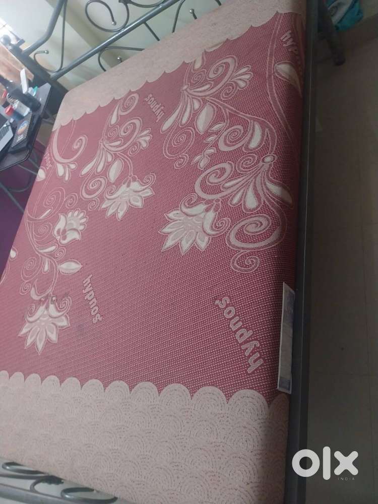 Bed with orthopedic mattress
