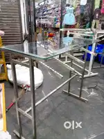 Shop display counter steel body with hanging and glass.