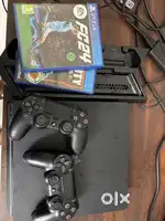 PS4 Slim 1 TB( 2 OG controllers & 2 games & stand)