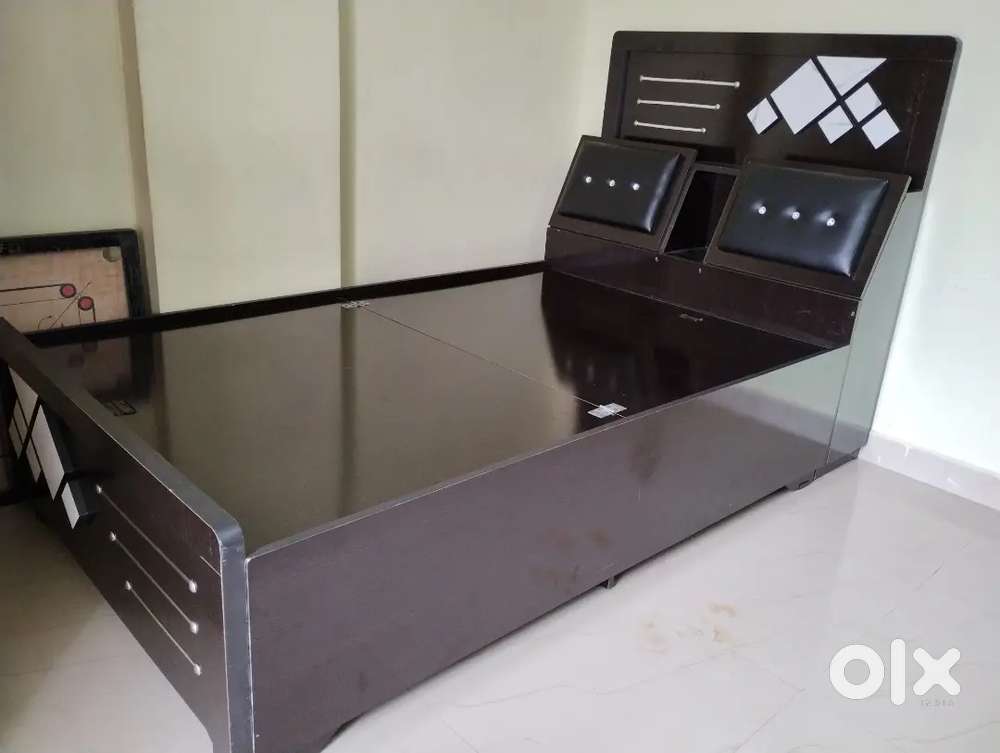 Full size storage bed with mattress.
