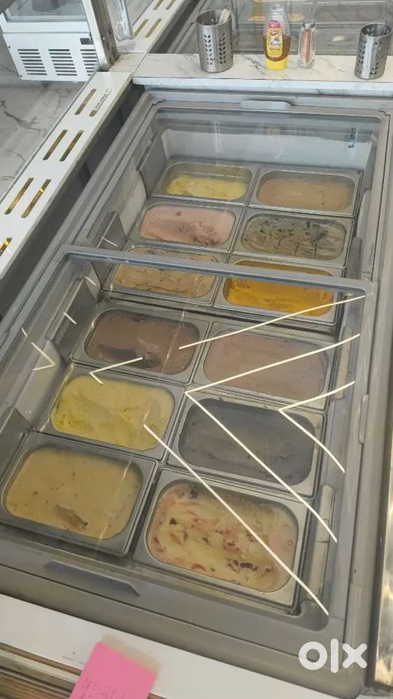 Sales boy in icecream parlour