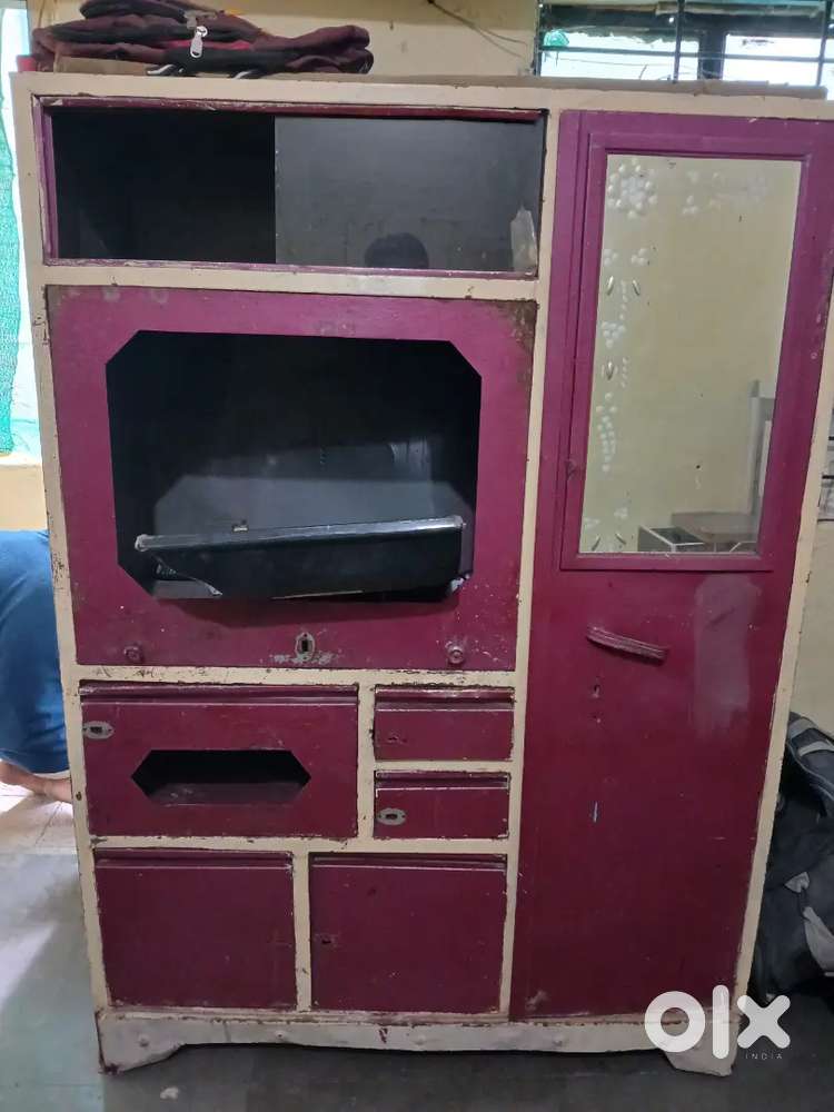 showcase cabinet  multiple drawers, and a small internal locker.