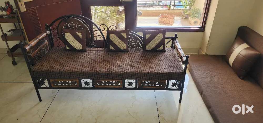 Antique wooden and iron sofa with cushions- excellent condition.