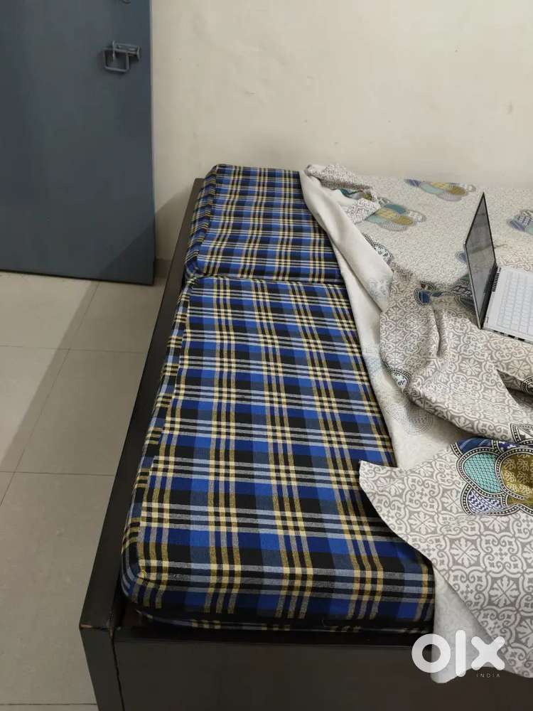 Mattress with cover. Each matters is 2700 Rs . One plastic Table 900/-