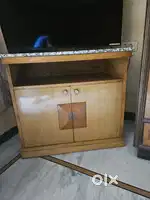 Table with storage with stone on top