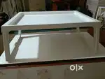 Dining table for breakfast on bed.