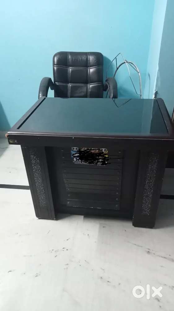 Office table and plastic chairs